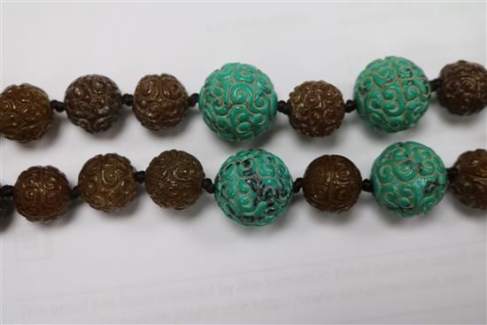 A carved turquoise and agate bead necklace.